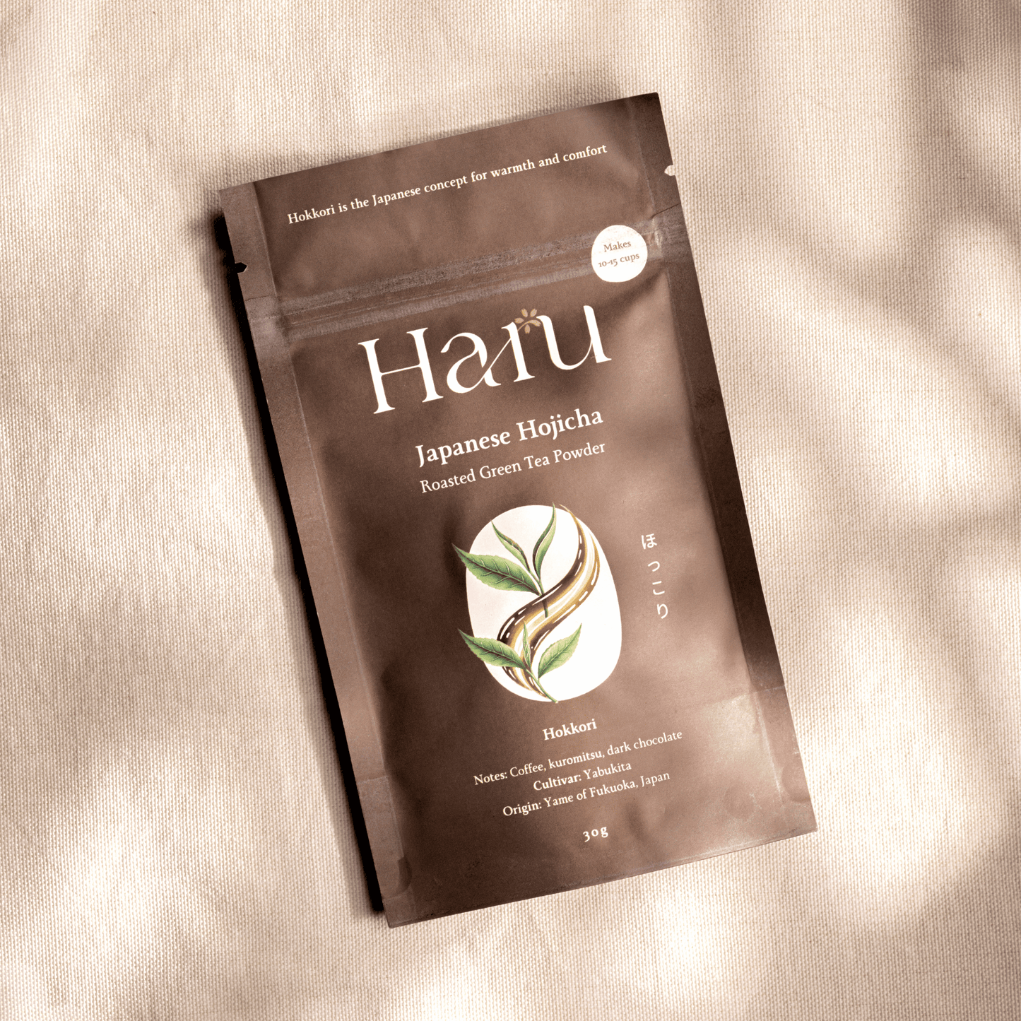 Haru Japanese Hojicha roasted green tea powder package on a beige background