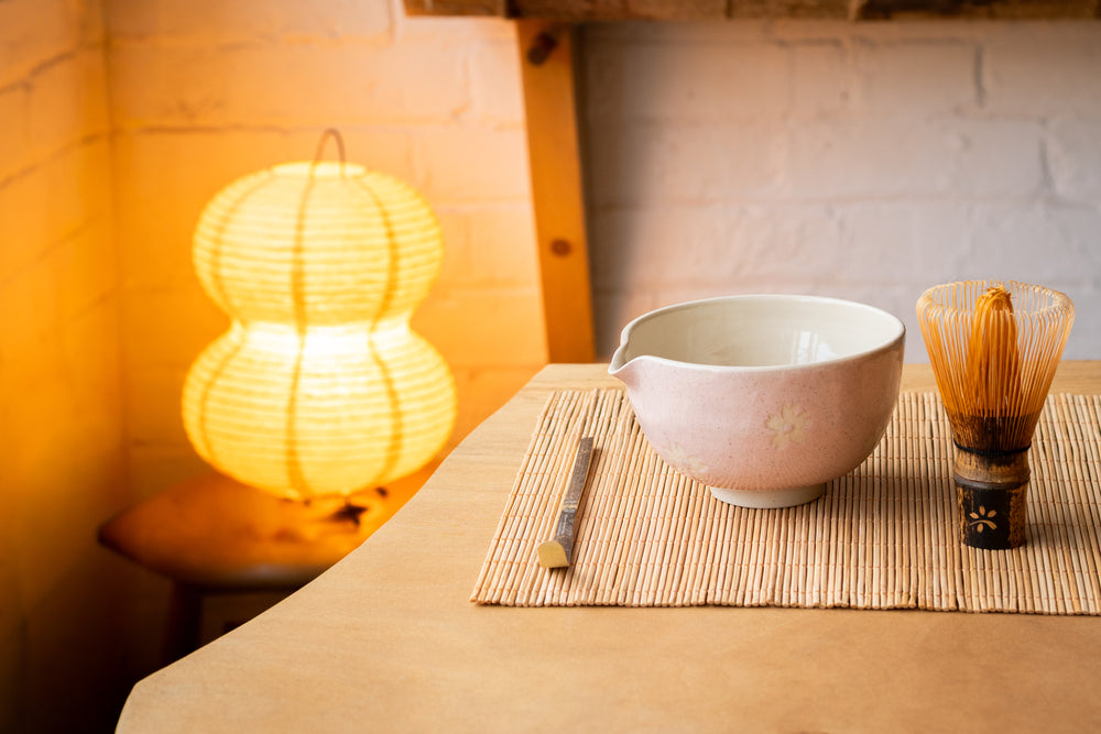 Ceramic bowl on a wooden surface with a warm background